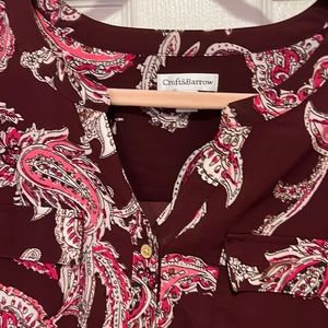 Paisley top with front pockets. Buttons down the front of blouse. Gently used.